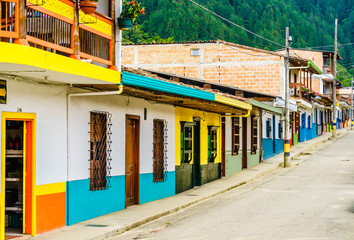 Fototapeta na wymiar View on colonial buildings in the street of Jardin, Colombia