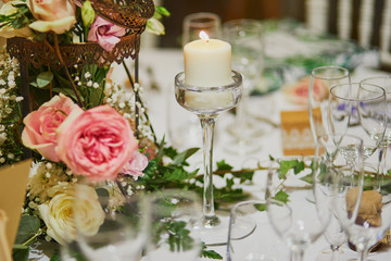 Beautiful table set with candles and flowers