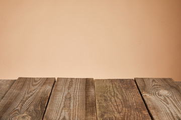 empty rustic wooden table isolated on brown