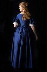 renaissance woman in a blue silk dress