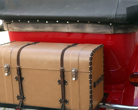 Old Big Siutcase And A Red Vintage Car