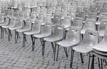 gray chairs set up in St. Peter Square for the Pope mass of the