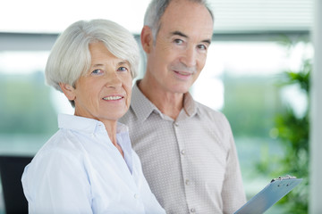 a senior couple in the office