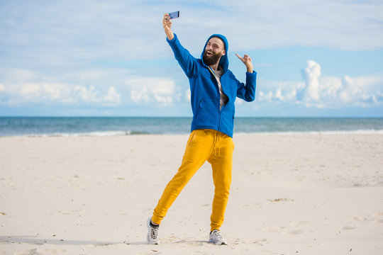 hipster taking Selfie by the seaside 