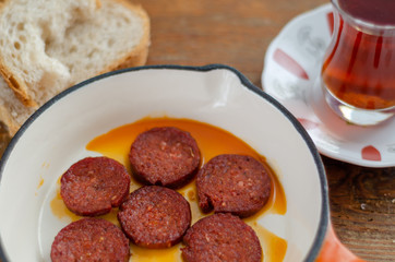 Fried turkish sucuk and tea