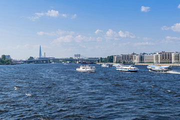 Little Neva River with sightseeing boats and two hydrofoils and Betancourt Bridge  in Saint...