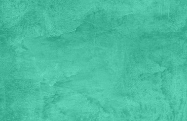Trendy mint colored low contrast Concrete textured background with roughness and irregularities to your design or product. Color trend concept.