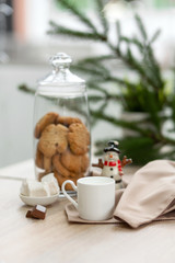 Bar counter in a coffee shop with New Year's decorations, cookies, sweets and coffee
