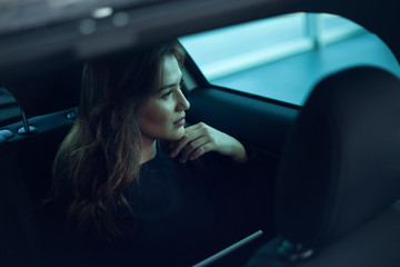 Fototapeta na wymiar young woman driving car on the road
