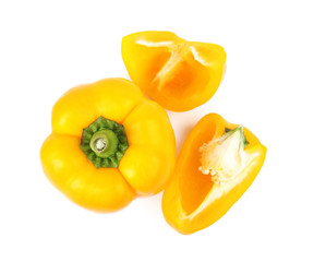 Whole and cut yellow bell peppers isolated on white, top view