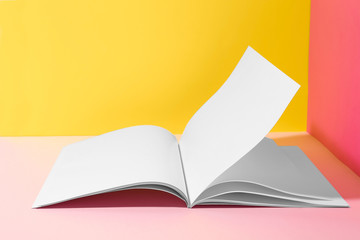 Empty book pages on color background. Mockup for design