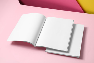 Empty book pages on color background. Mockup for design