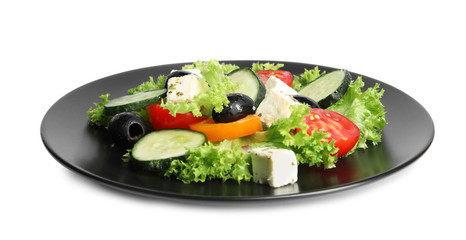 Tasty fresh Greek salad on white background