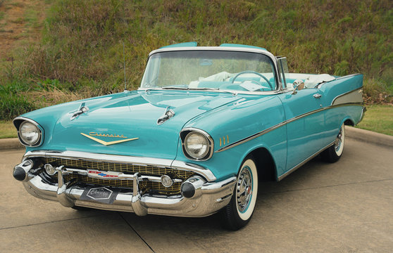 Front side view of an aqua color 1957 Chevrolet Bel Air Convertible classic car on October 21, 2017 in Westlake, Texas.