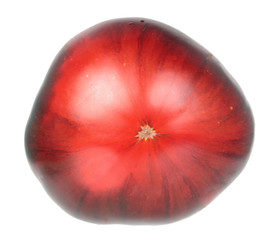 Fresh ripe black tomato isolated on white background