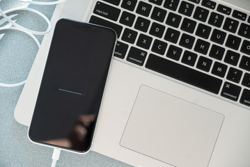 smartphone and laptop setup almost complete