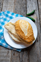 Mexican green tamal sandwich also called 