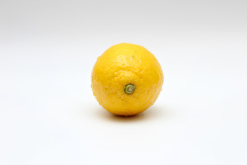 Fresh, ripe, isolated, juicy single lemon on a white background. Studio macro shoot