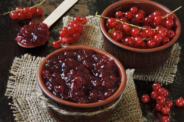 Homemade redcurrant jam. Fresh berries of red currant. Concept cooking jam.