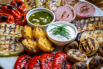 grilled vegetables on a plate on wooden table. Turkish cuisine.