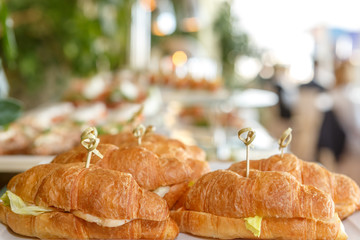 Croissant sandwiches on the background of the restaurant hall