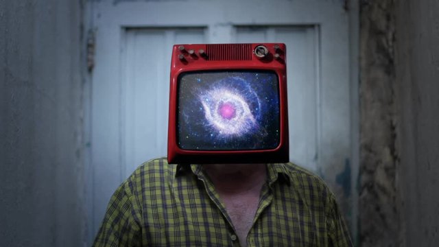 Eye of God Nebula in the TV Head of a Man. TV on the Head of a Man. Surreal Concept. Elements of this video furnished by NASA.  