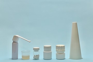 A row of vials of tubes of medicine.