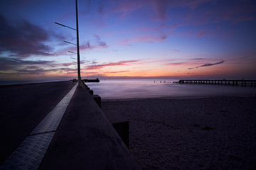 sunrise skyline in twilight time with seascape and sea dock