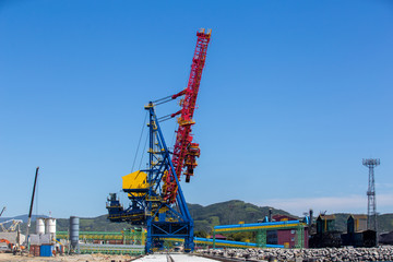 Fototapeta premium Construction cranes on the territory of the marine coal terminal.