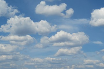 Fototapeta na wymiar Beautiful blue sky with white fluffy clouds, natural background
