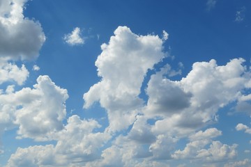Naklejka na ściany i meble Blue sky with big fluffy clouds, natural background