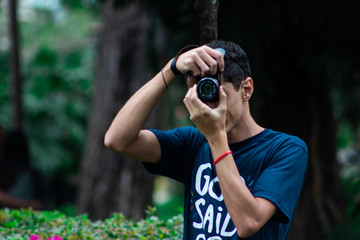 Fototapeta premium young man with a camera