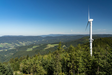 Wind turbine on a mountain peak of the Black Forest, Germany
