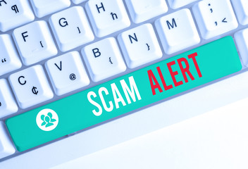 Writing note showing Scam Alert. Business concept for unsolicited email that claims the prospect of...