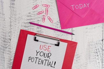 Conceptual hand writing showing Use Your Potential. Concept meaning achieve as much natural ability makes possible Colored clipboard paper sheet pencil clips wooden background