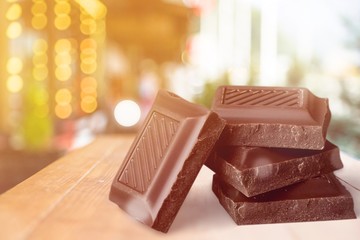 Delicious chocolates isolated on background