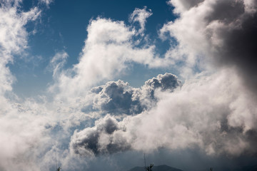 Puffy Clouds at sunset viewed from high lookout in Tiger Hill, India