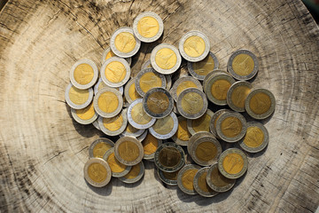 money stack is put together on old wood background