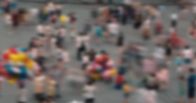 Defocus, blurry, abstract 4k time lapse of crowd of people walking, playing on the playground in Hanoi city. High-quality free stock time lapse video footage view of crowd of people walking