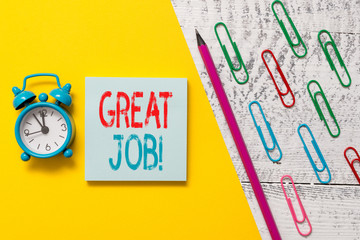 Handwriting text Great Job. Conceptual photo sed for telling someone that they have done something well Notepad marker pen colored paper sheet clips alarm clock wooden background