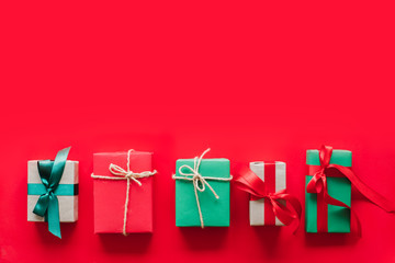 Gift/presents box over red background for chirstmas and happy new year concept with copy space. topview flatlay