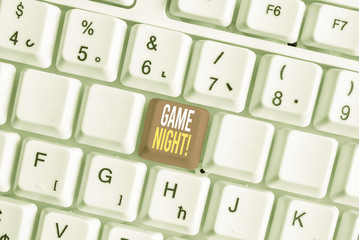 Word writing text Game Night. Business photo showcasing usually its called on adult play dates like poker with friends White pc keyboard with empty note paper above white background key copy space