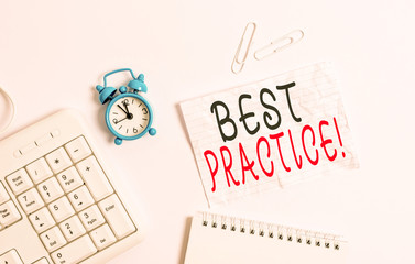 Writing note showing Best Practice. Business concept for commercial procedures that are accepted prescribed being correct Blank paper with copy space on the table with clock and pc keyboard