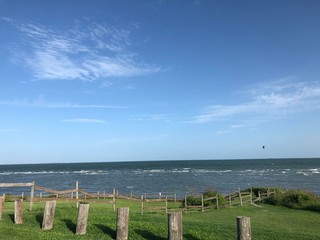 ocean view/flying birds from cliff of gulf coast and fence