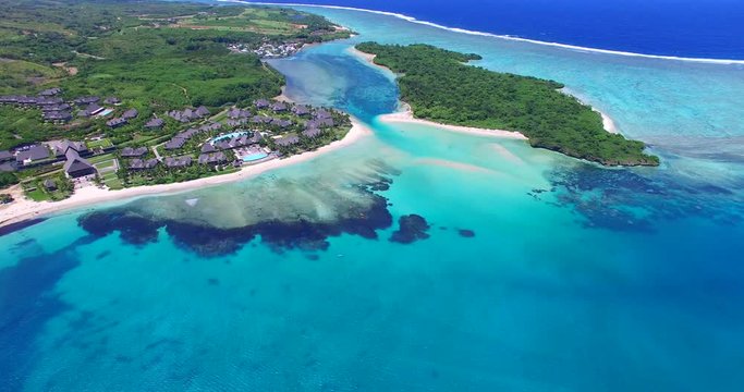 Aerial of Fijian resort, Lagoon and outer ocean. All the shades of Blue.