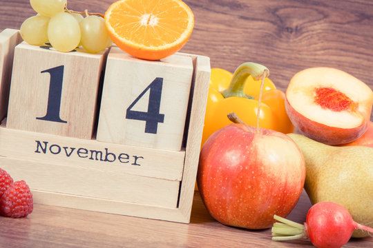 Date 14 November on calendar and fruits with vegetables, world diabetes day and fighting disease concept