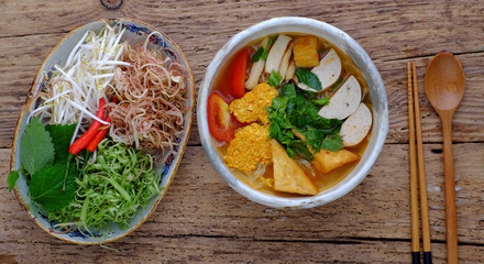 bowl of homemade vegan rieu noodle soup or vegetarian crab paste vermicelli soup
