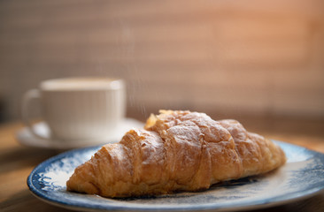 Bread on wooden table with copy space background. Breakfast morning in vintage style.
