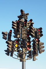 many traffic lights on one post