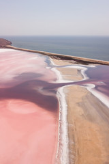 Pink Koyashskoye salt lake in Krym and Black Sea coast. Aerial view. Trendy coral color